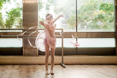 A little girl practising ballet